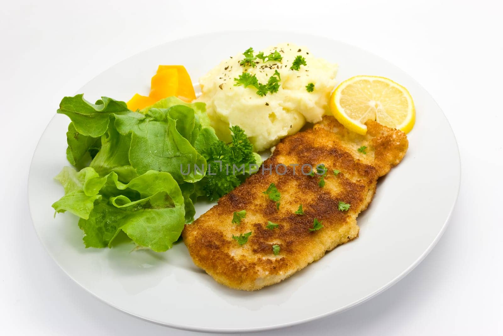 Schnitzel breaded with salad