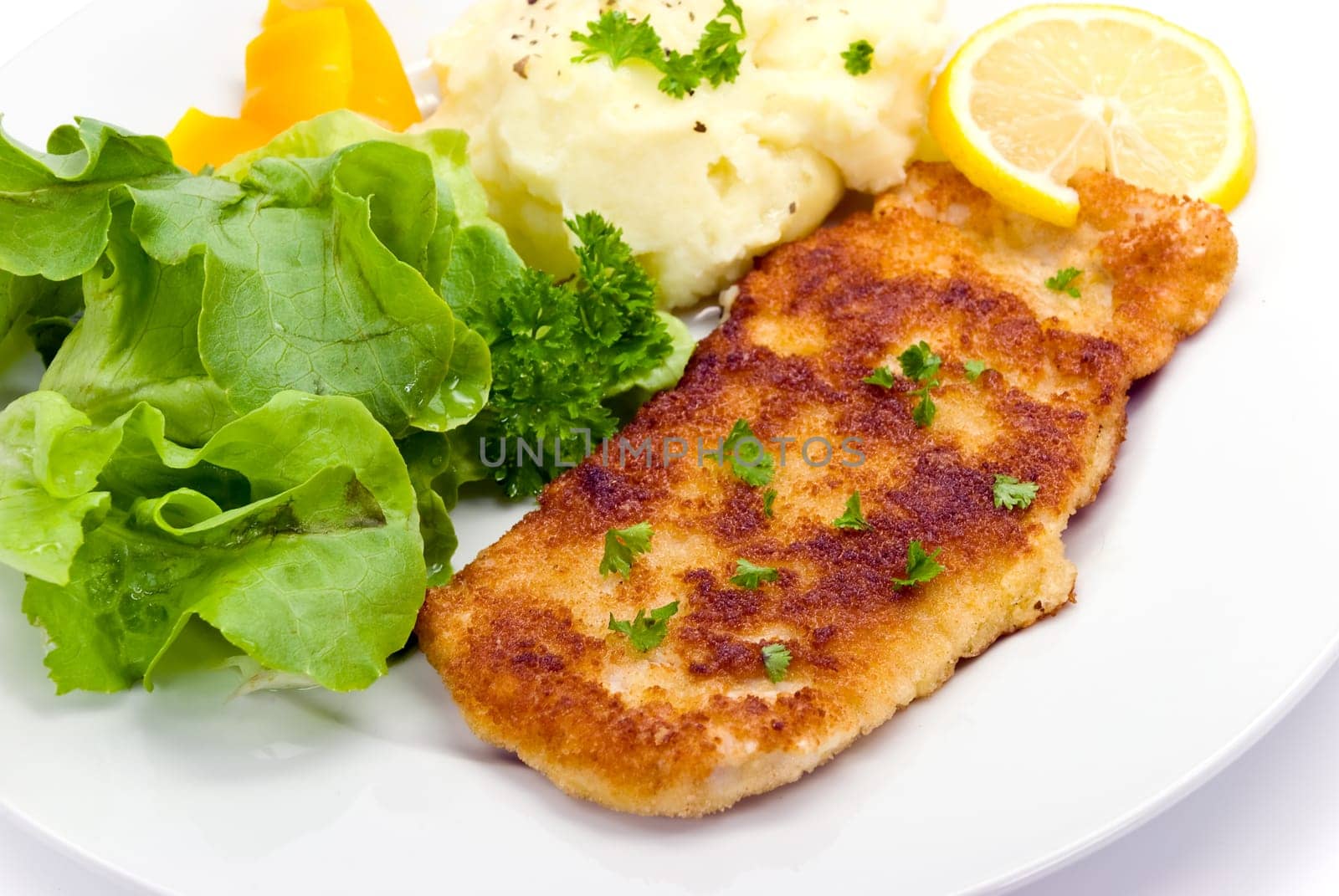 Schnitzel breaded with salad