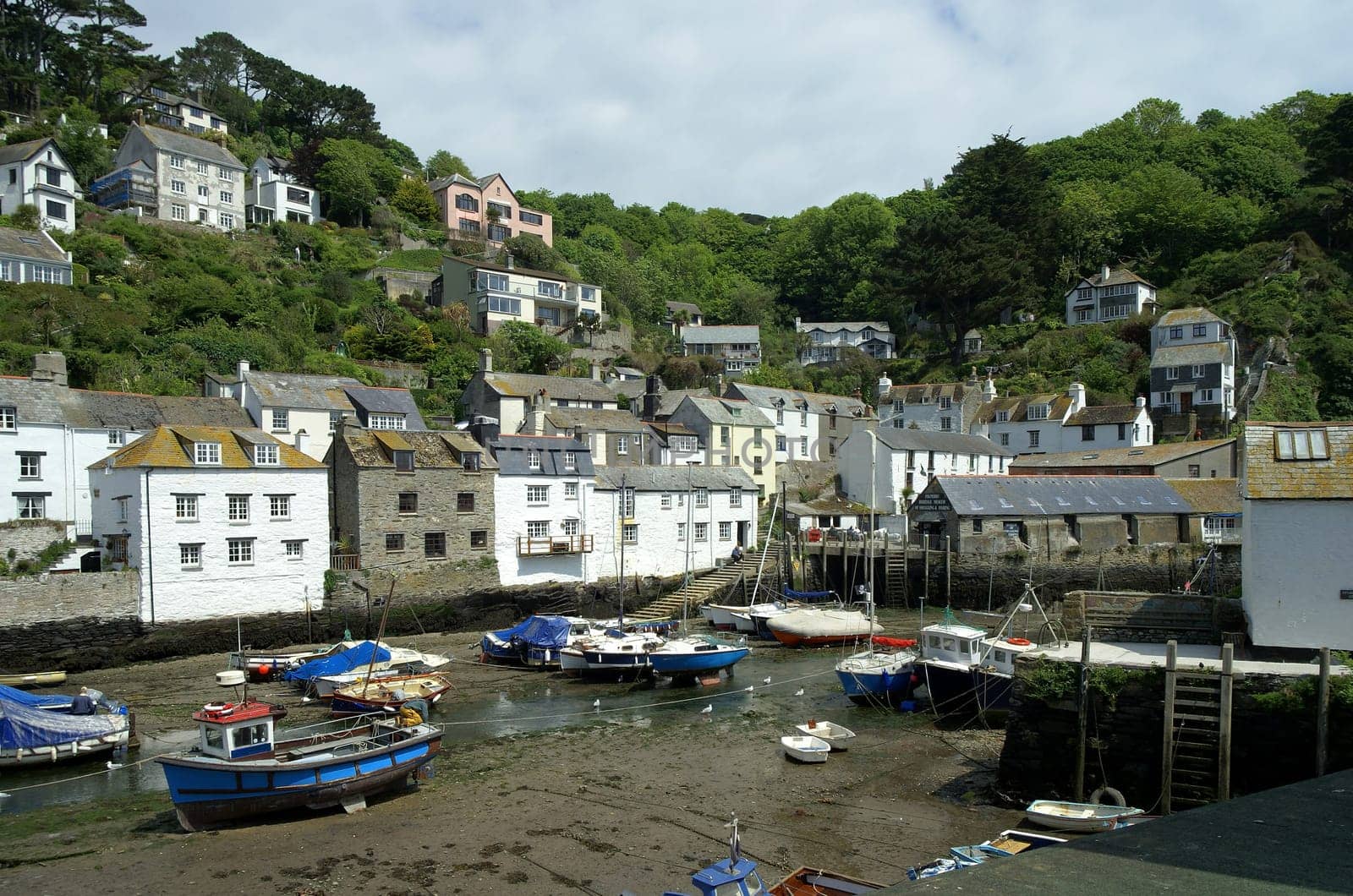 The harbour of Polperro,a small quirky fishing village on the south-west coast footpath that runs along the coast on both sides. South Cornwall,UK