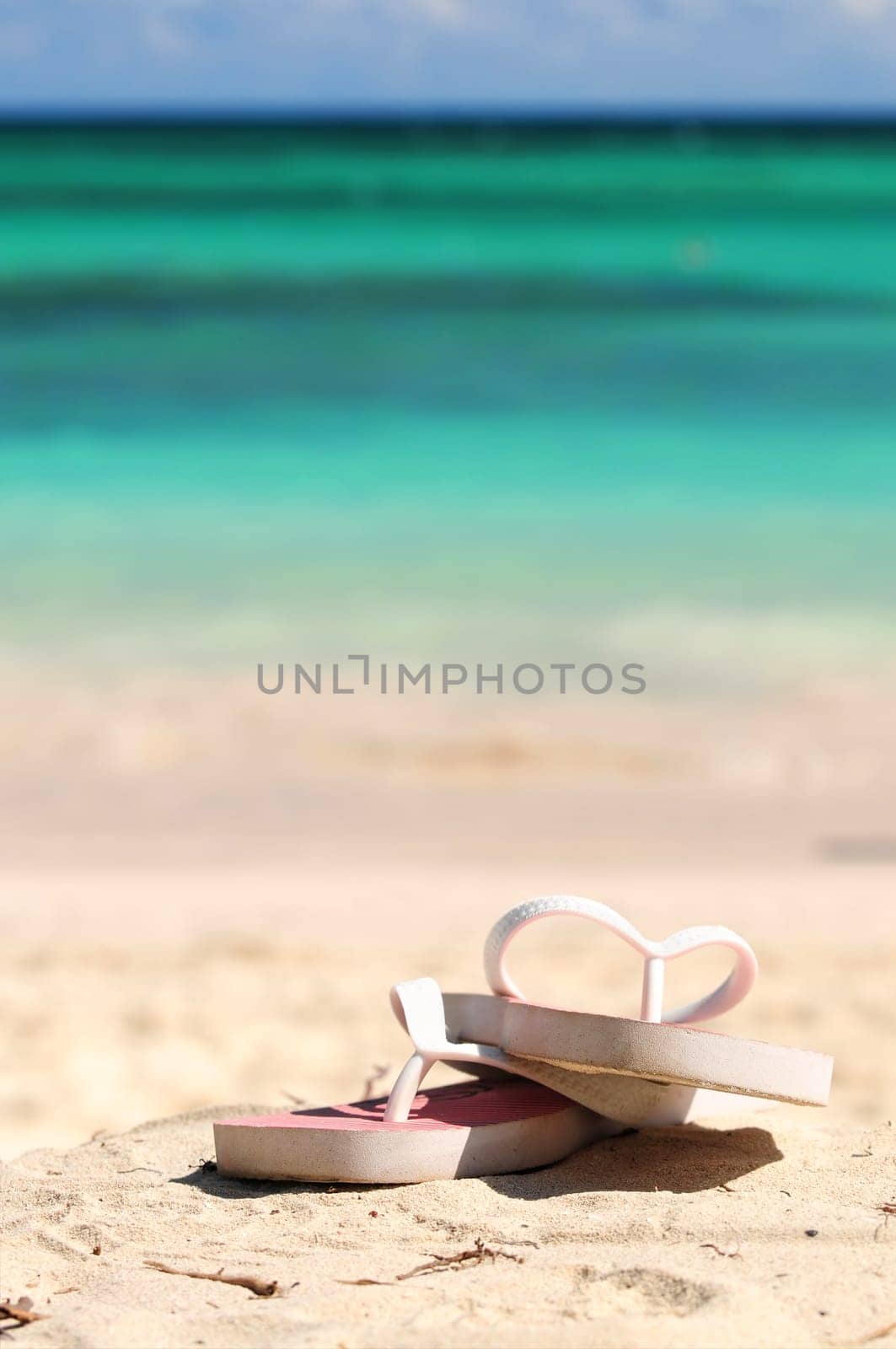 Flipflops on a sandy beach