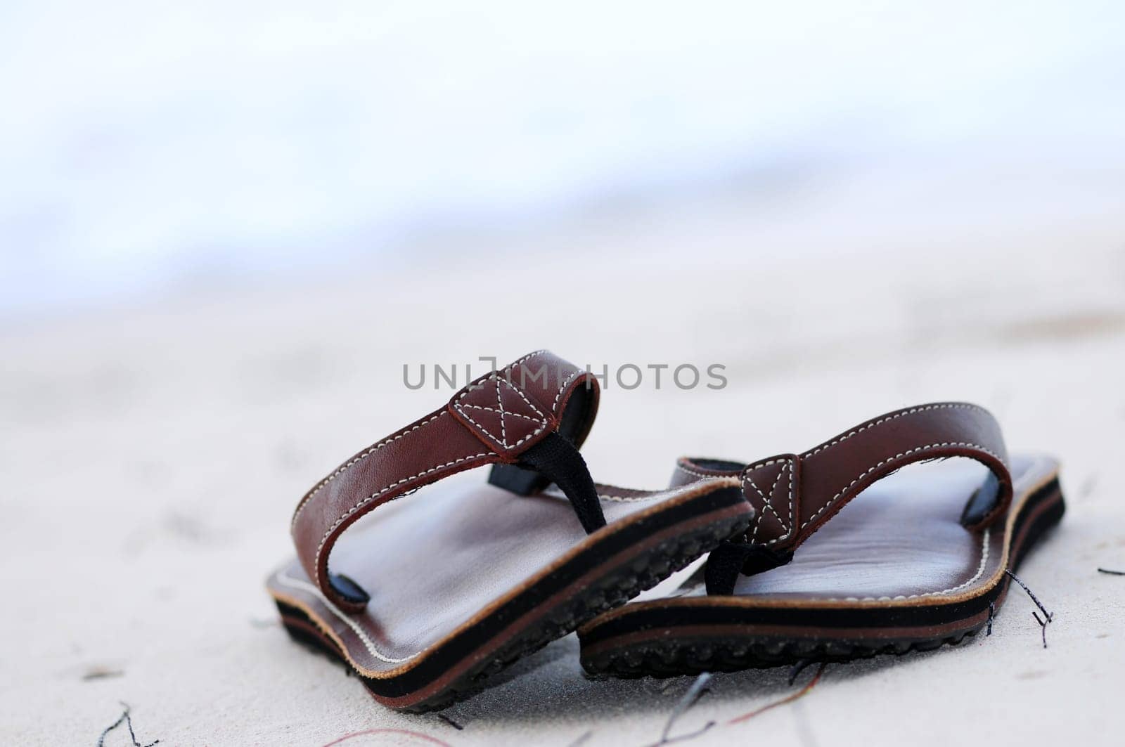 Flipflops on a sandy beach