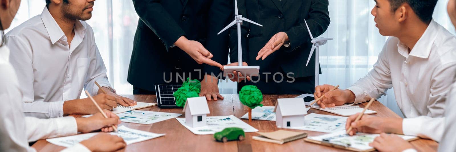 Eco business company meeting with group of business people planning strategy and discuss marketing of eco-friendly and renewable clean energy products. Green business company concept. Trailblazing