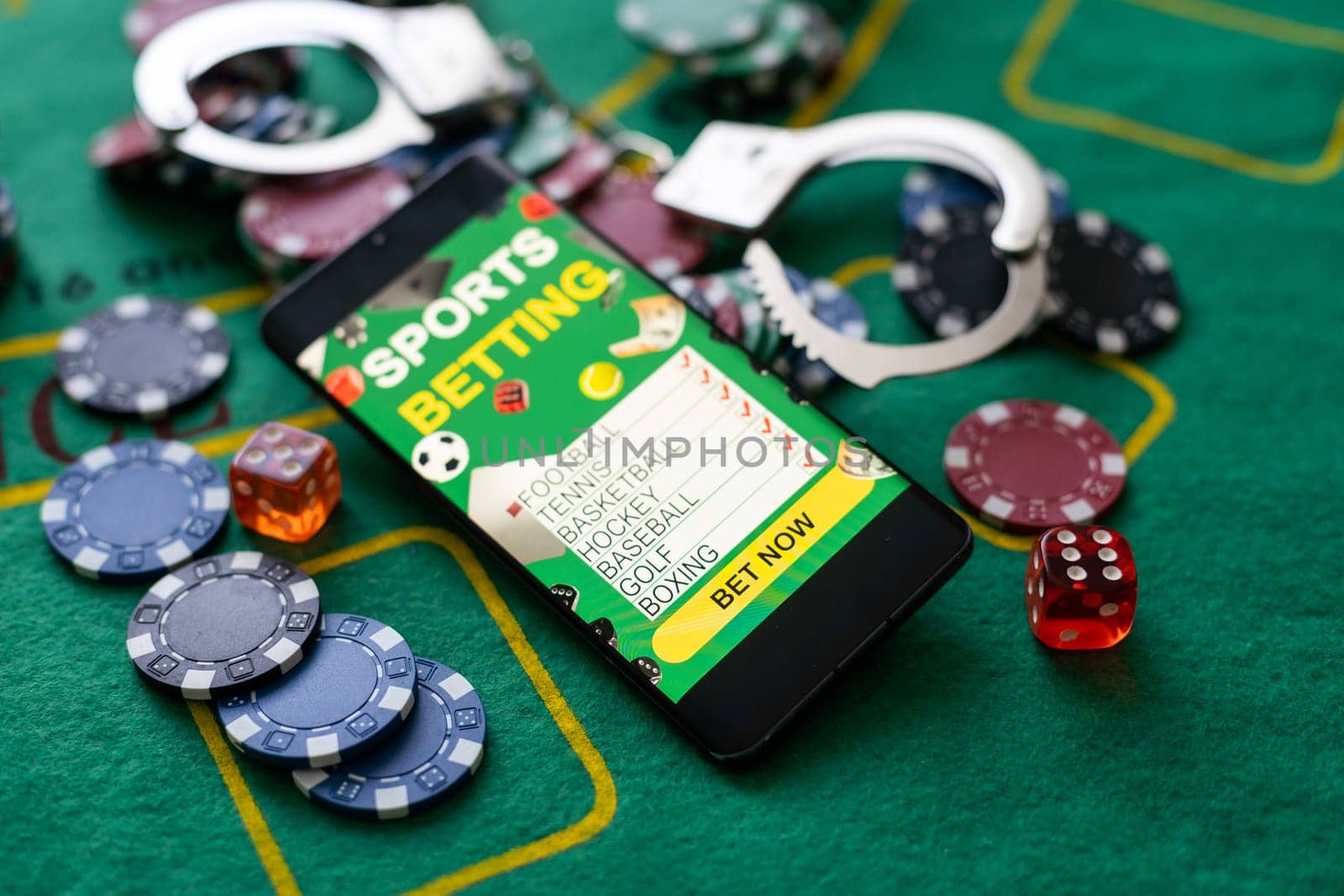 Casino chips a winning combination of cards flush royal next to the police handcuffs.
