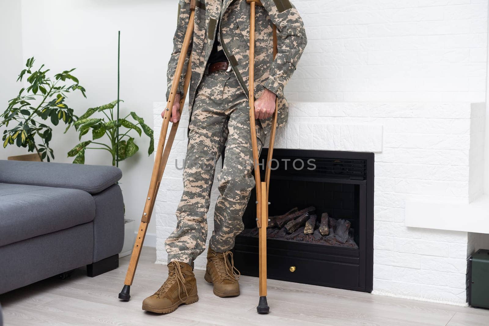 military man with crutches, disability.