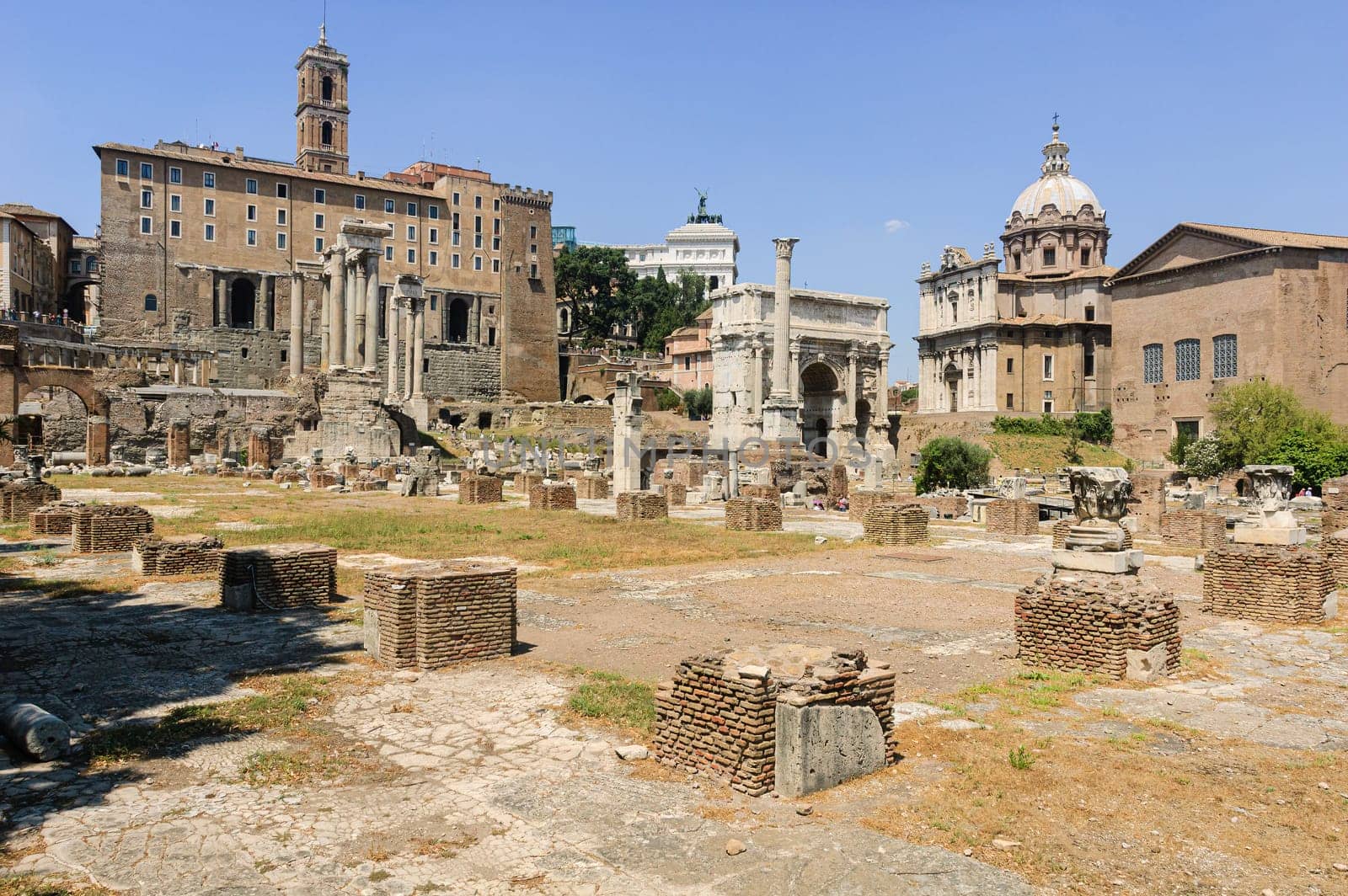 View of the Basilica Julia in the forum of Rome, with the Tabularium, the arch of Septimius Severus and the Curia in the background, among many other illustrious monuments