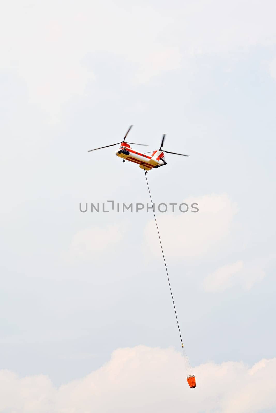 helicopter with water drop bucket