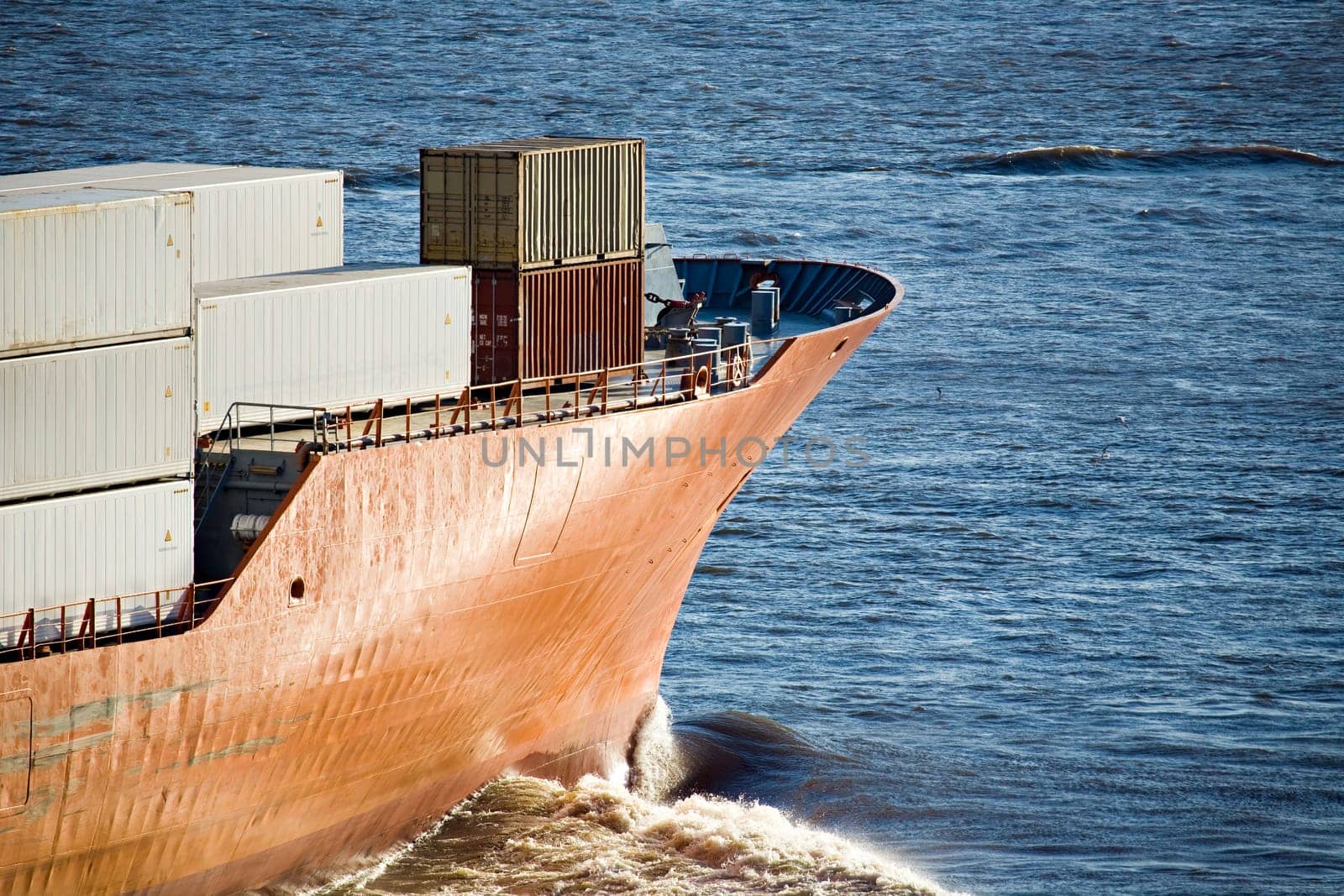 container ship heading out to sea