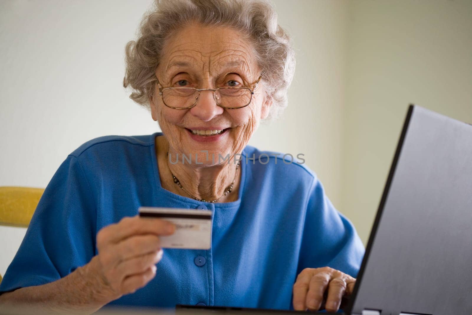 Elderly woman shopping online