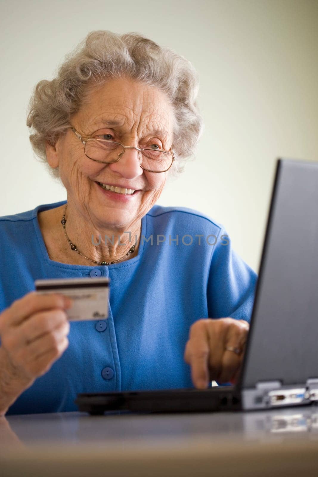 Elderly woman shopping online