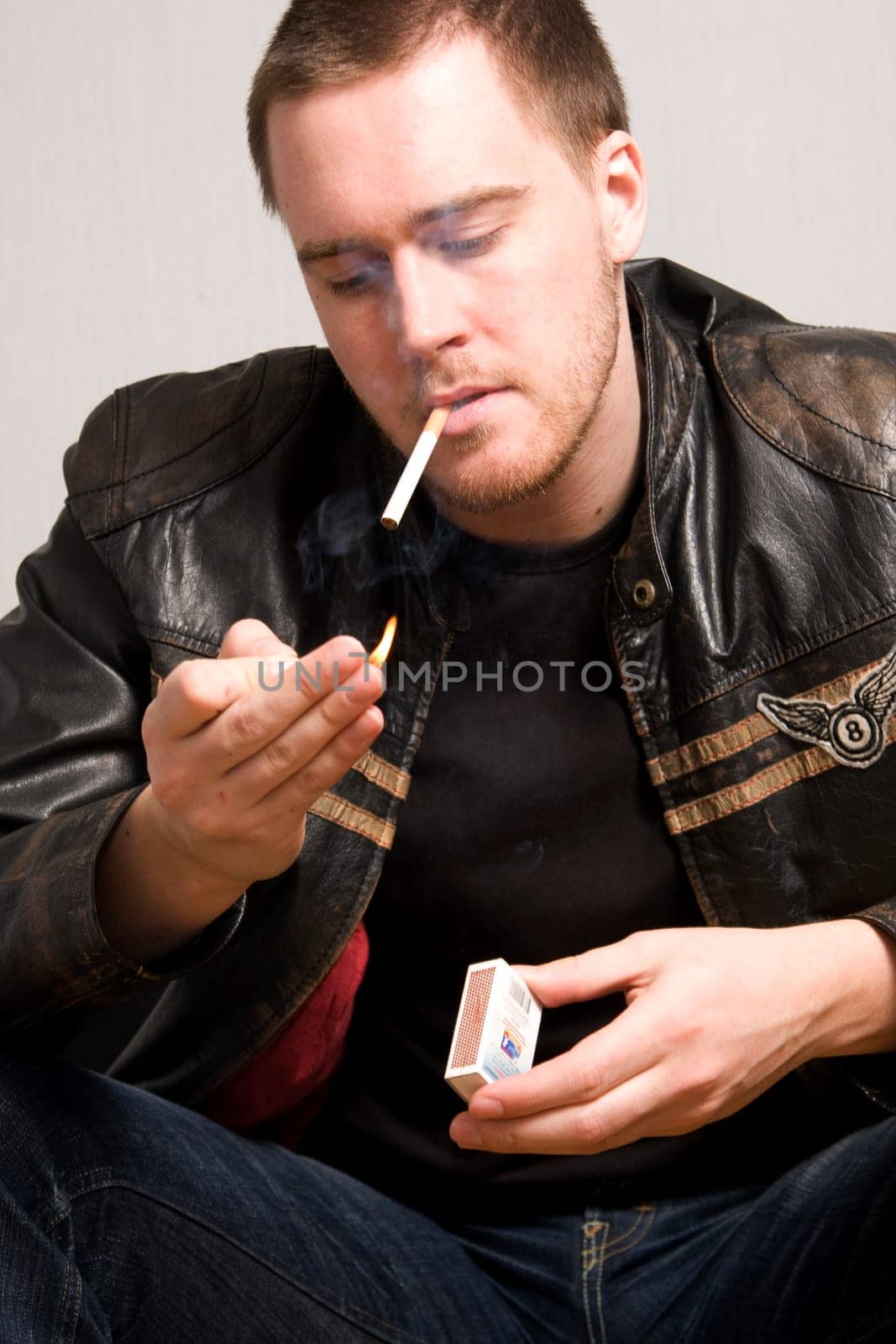 man smoking a cigarette