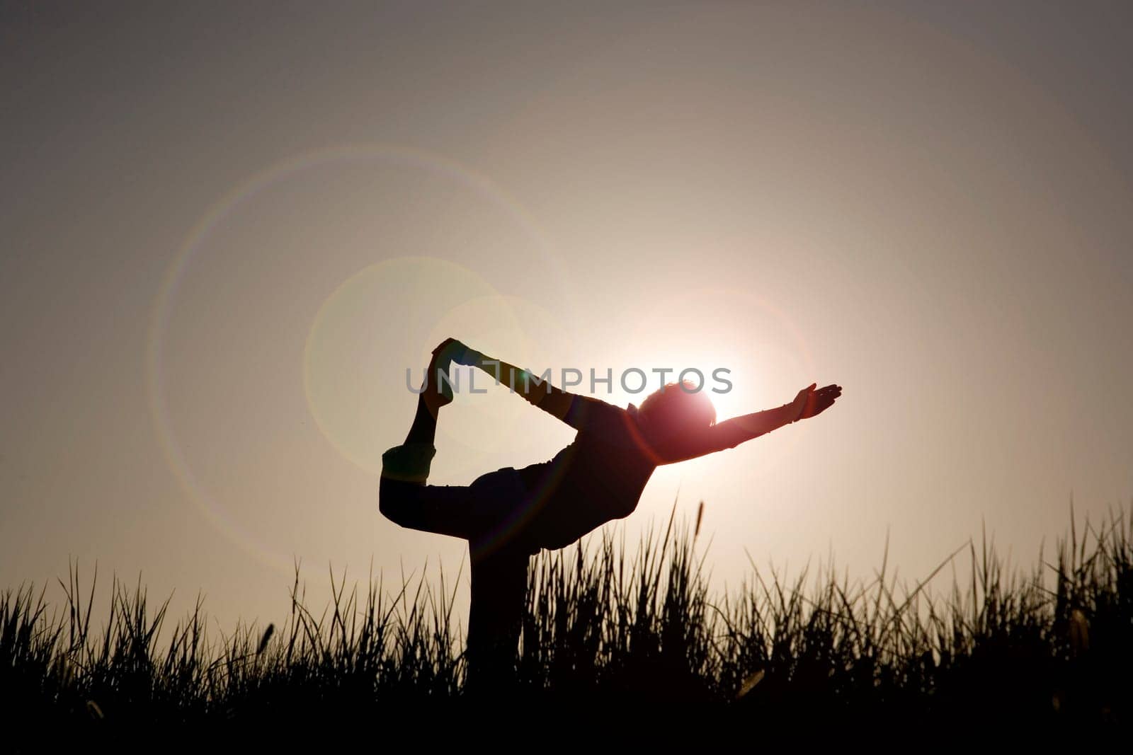 Woman doing yoga exercise - the dancer