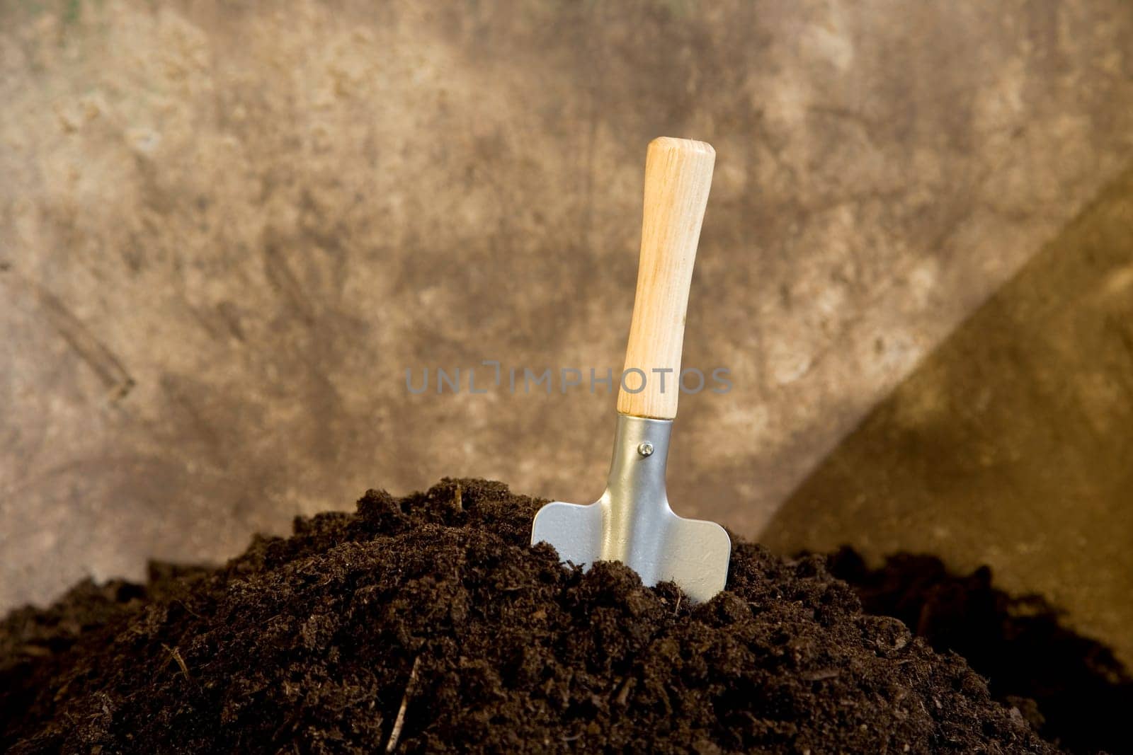 Shovel in garden soil