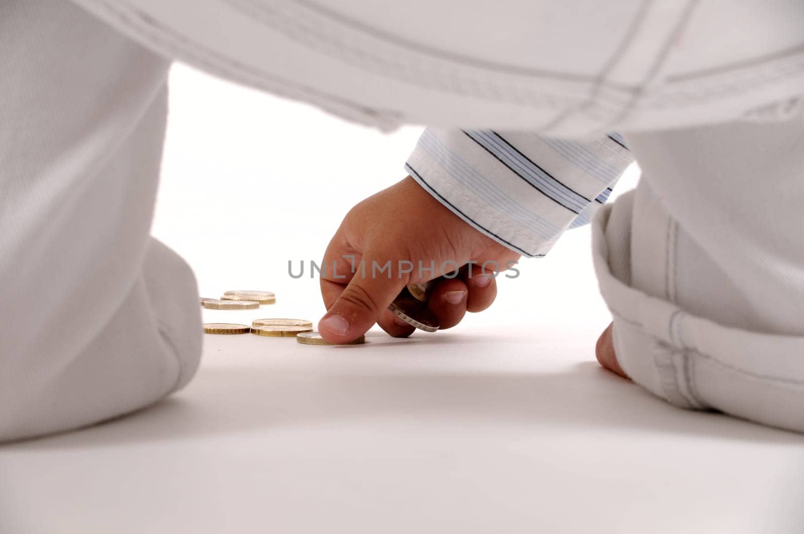 Child picking up coins