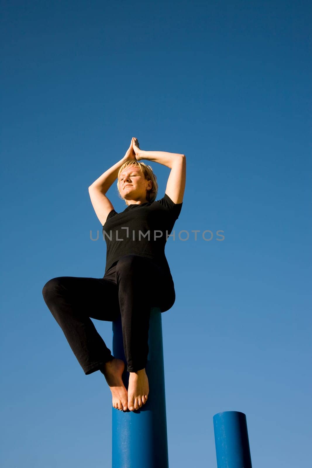 Woman doing yoga - eyes closed
