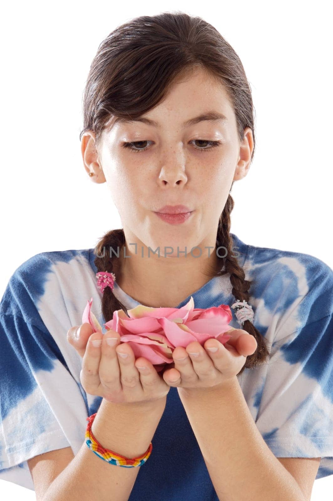 Cute girl blowing petals