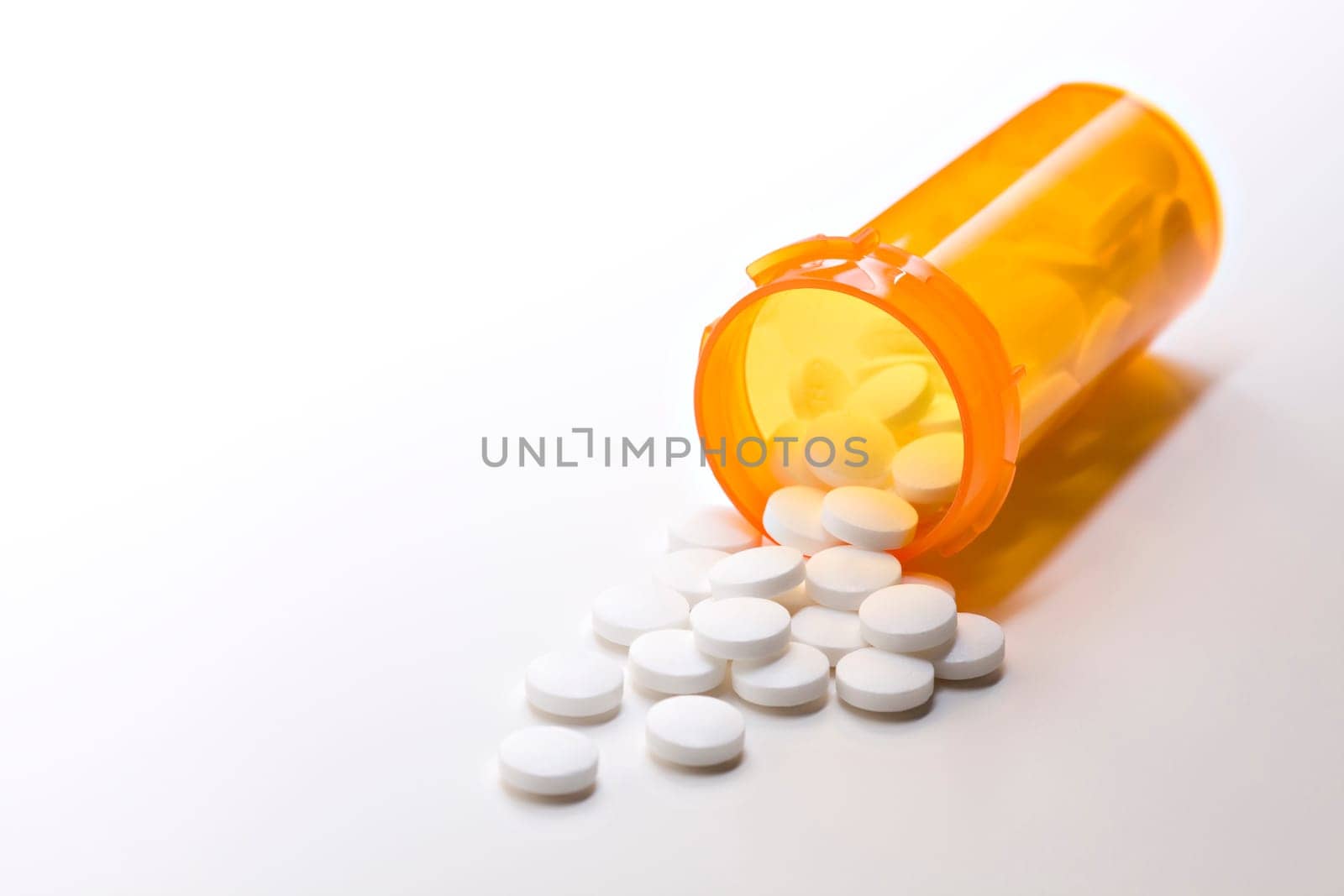 aspirin medicine with bottle on white