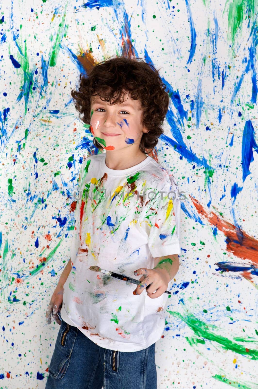 Boy playing with painting