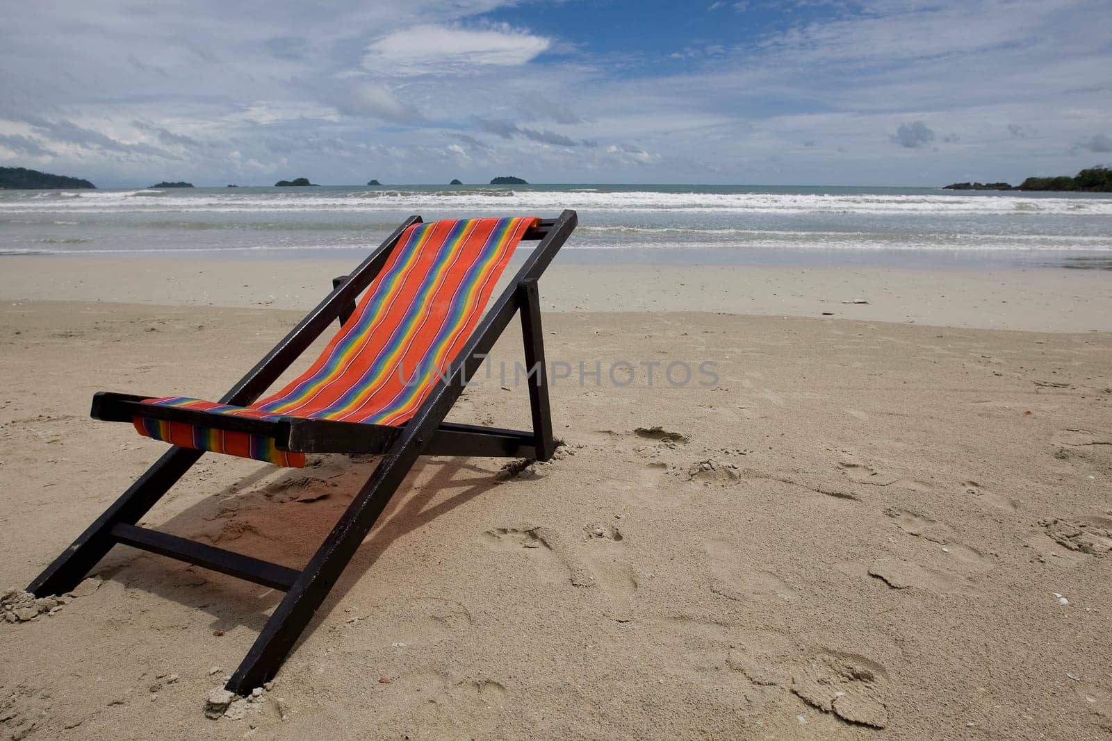Sun lounger on the sandy beach