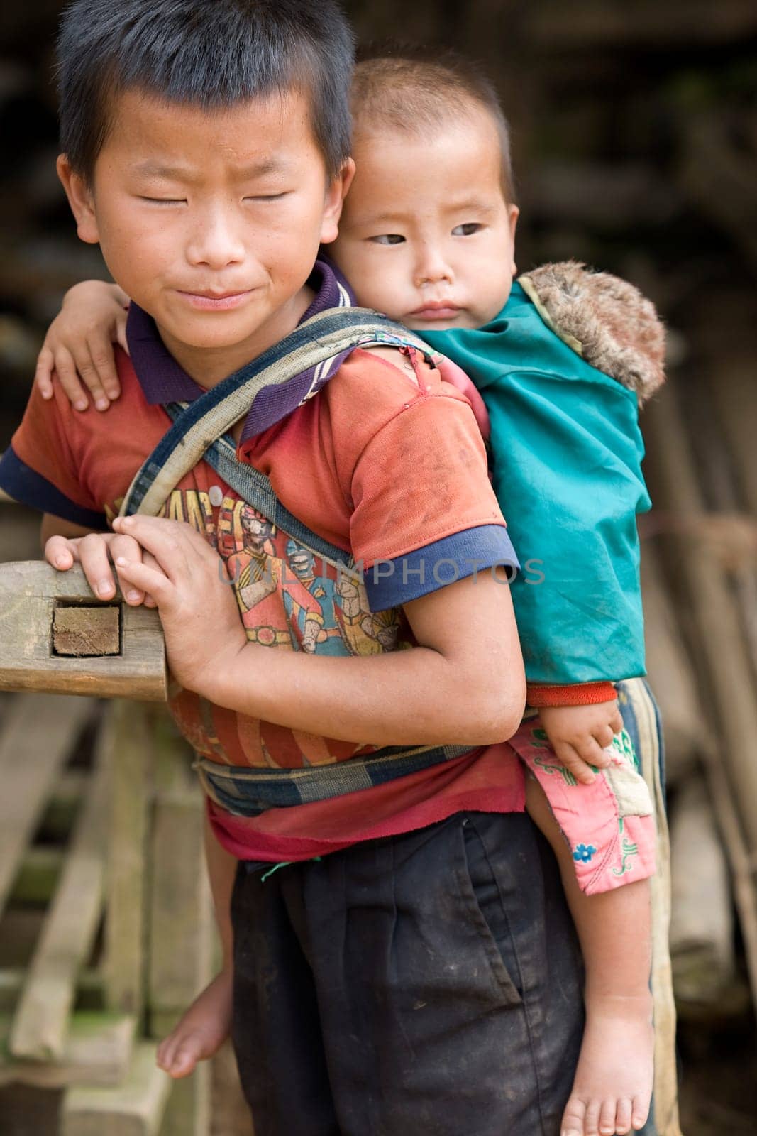 Laotian boy with baby