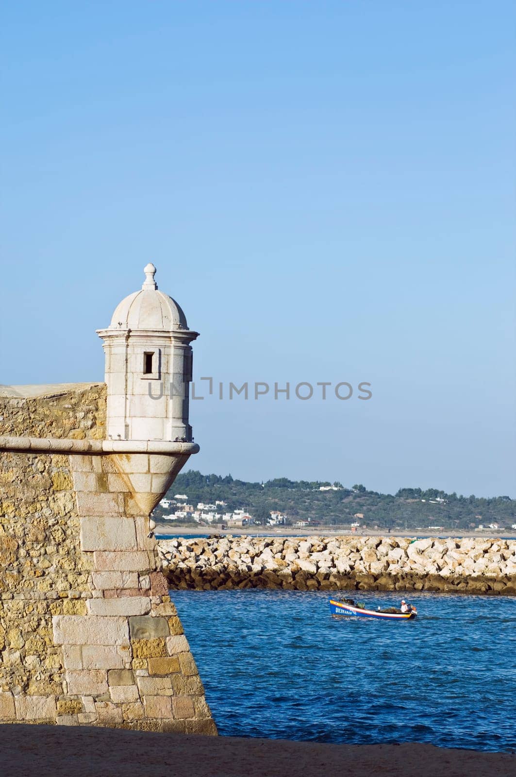 Small fishing boat entering the harbour