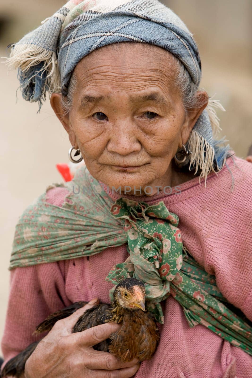 Asia,old woman with chicken