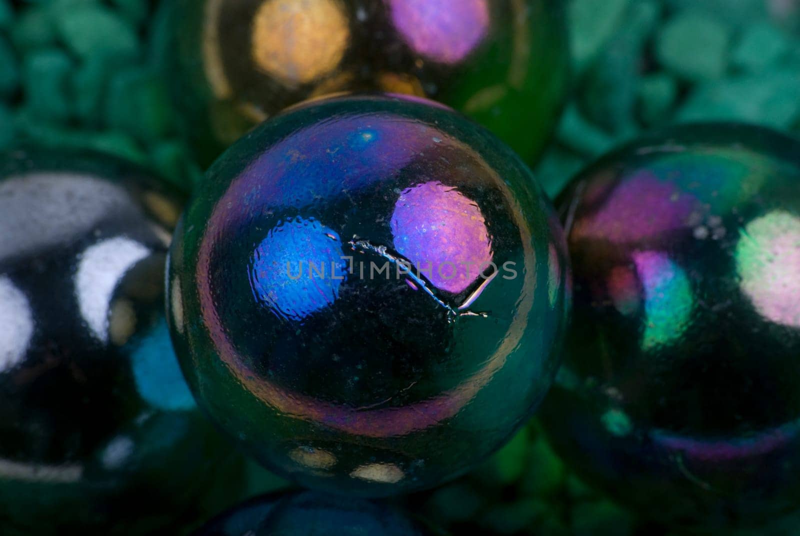 Glass marbles on green