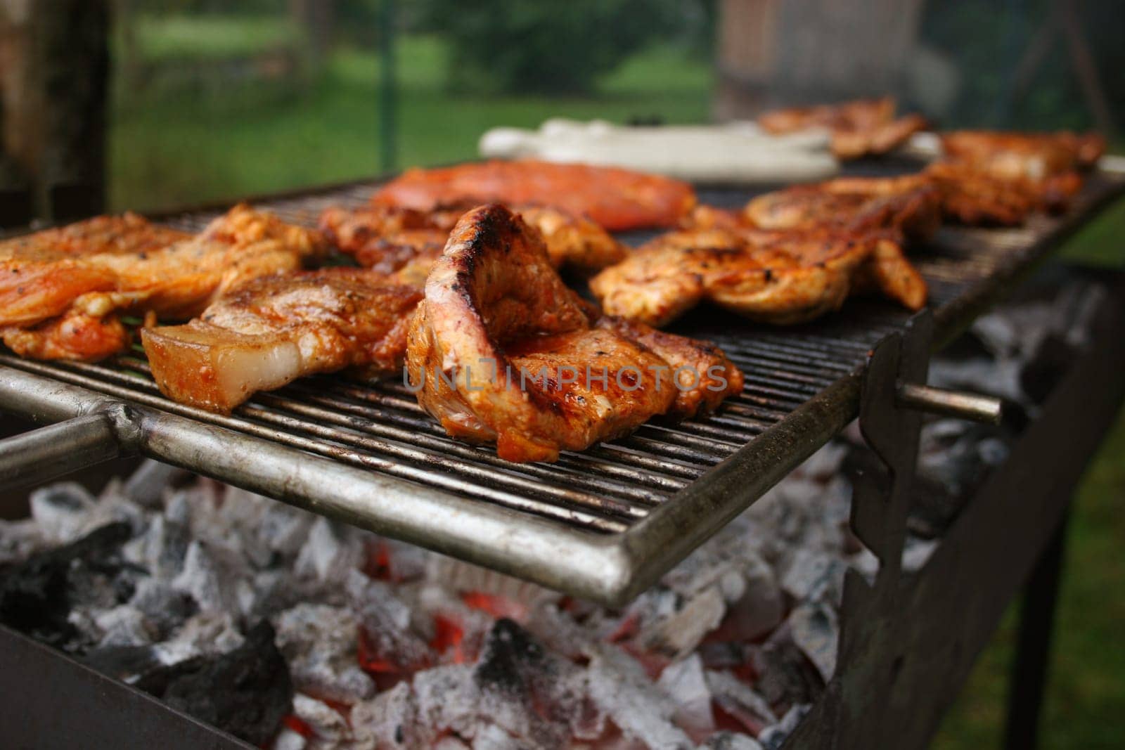 Steaks,bratwurst and Krakauer on grill