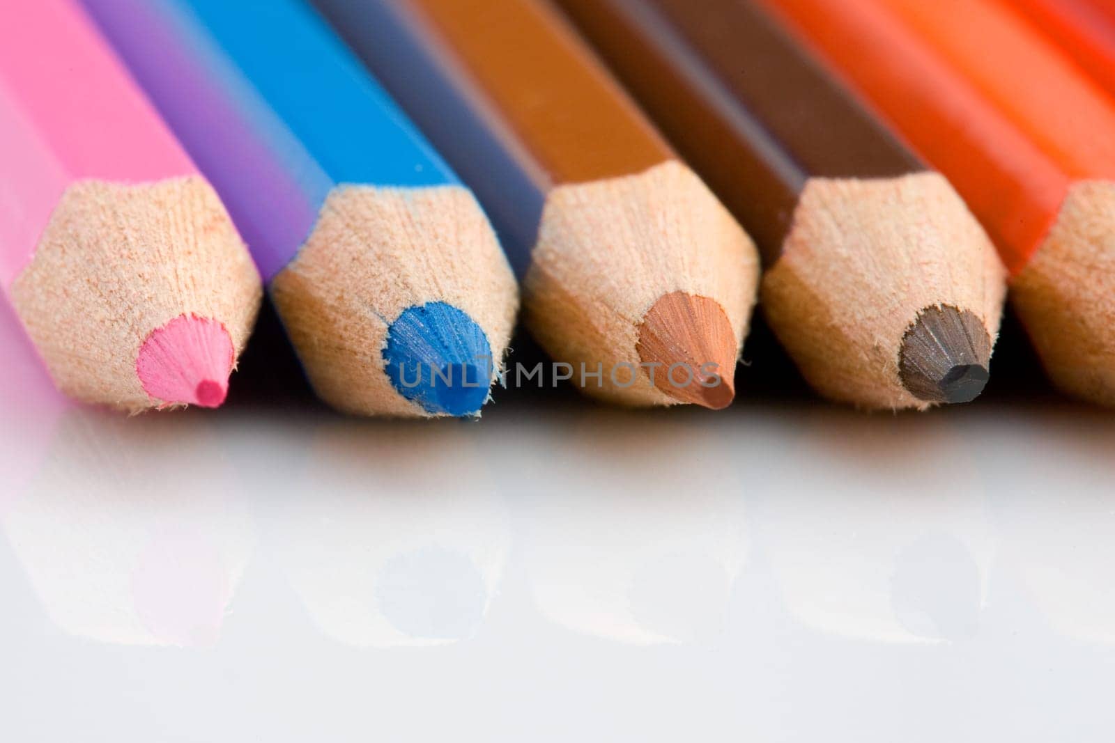 Pencils of many colors aligned