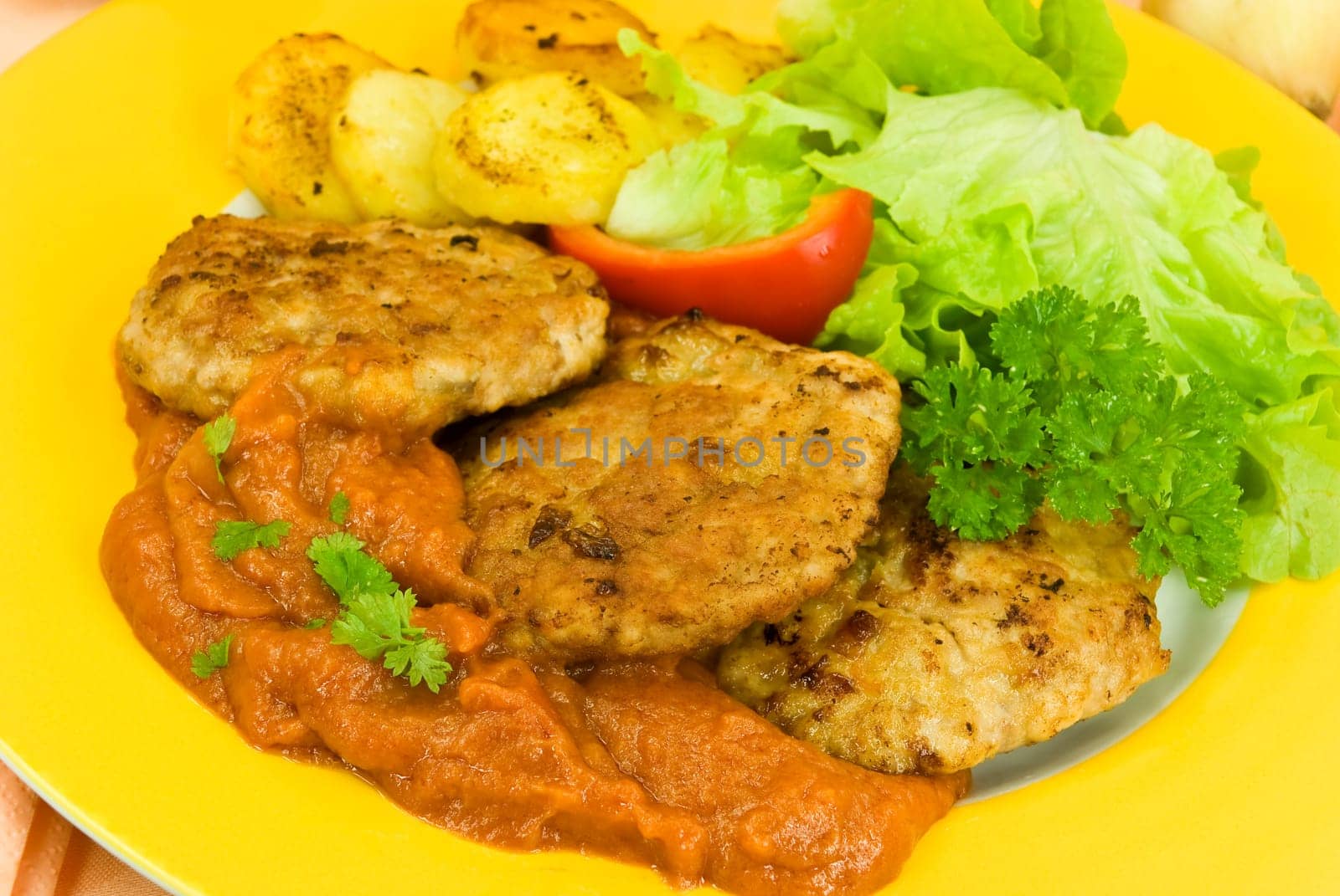 Meatballs with fried potatoes,tomato sauce