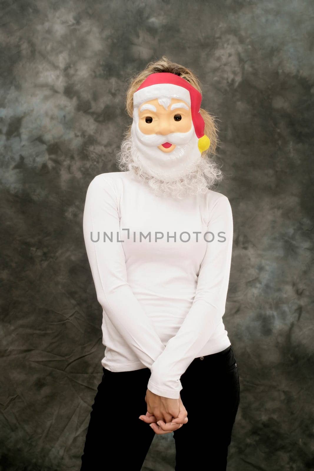 woman wearing Santa Clause mask