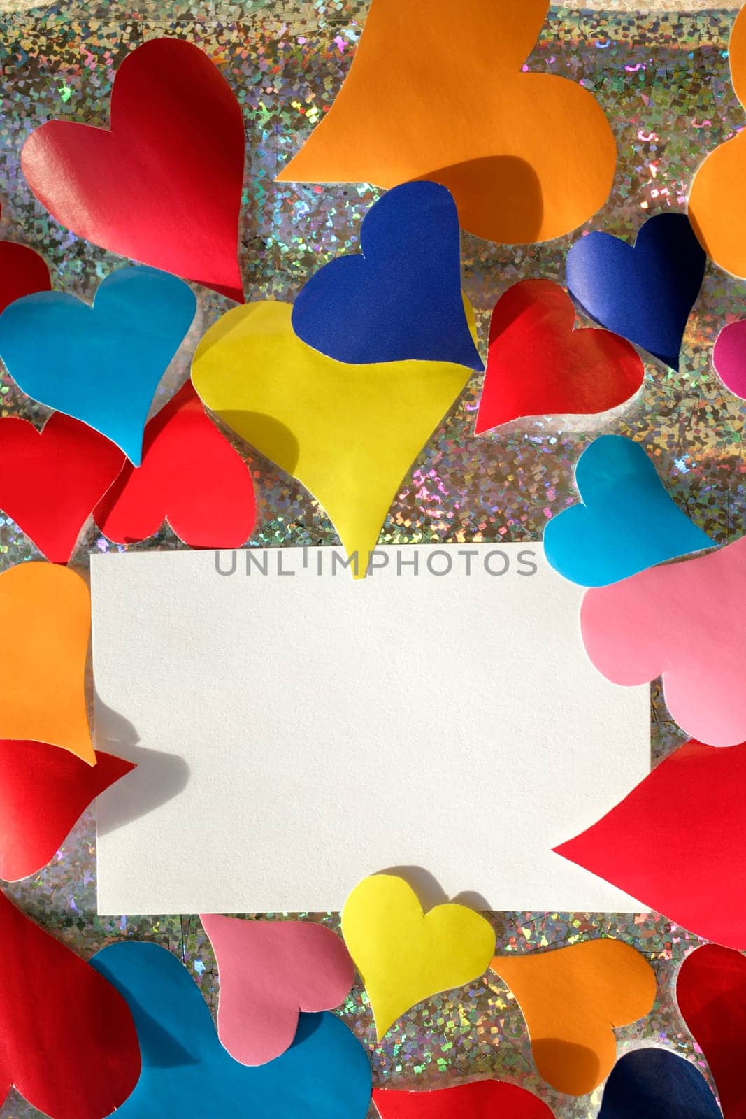 colorful paper hearts and note card