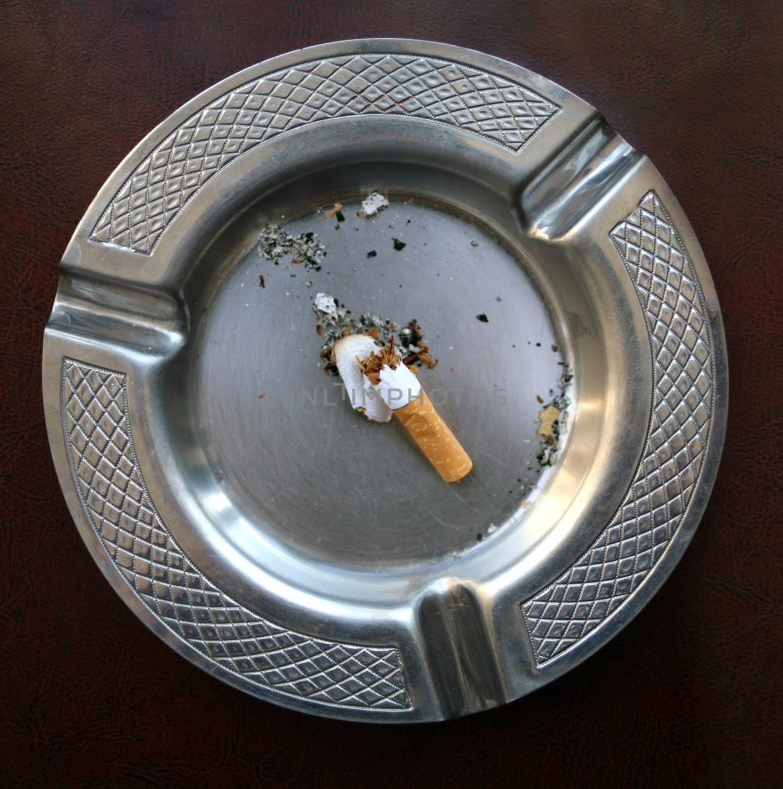 cigarette butt in ashtray