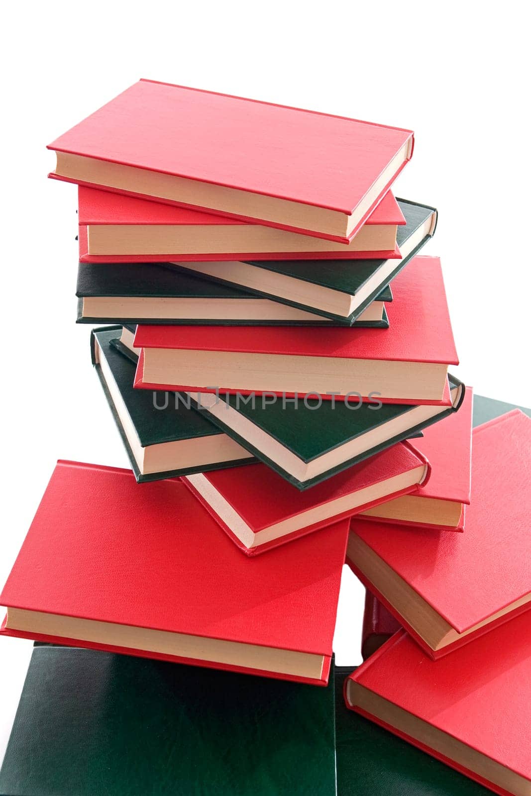 Many books stacked on a white background
