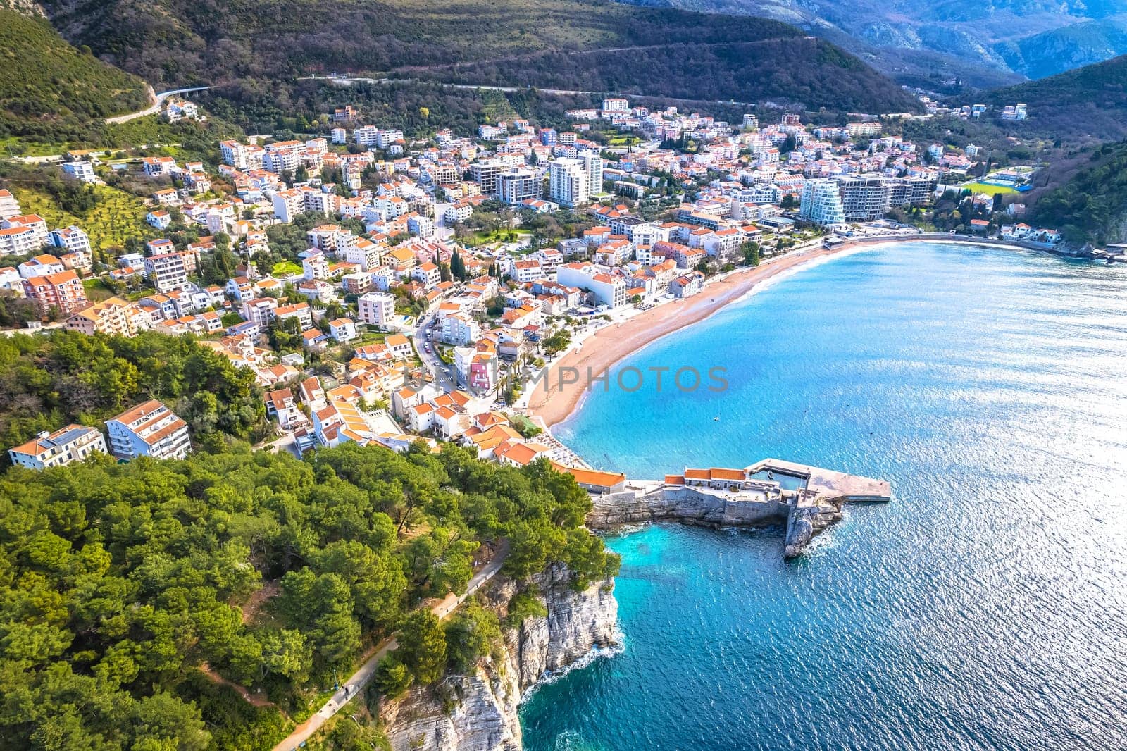 Town of Petrovac beach and coastline aerial view, archipelago of Montenegro