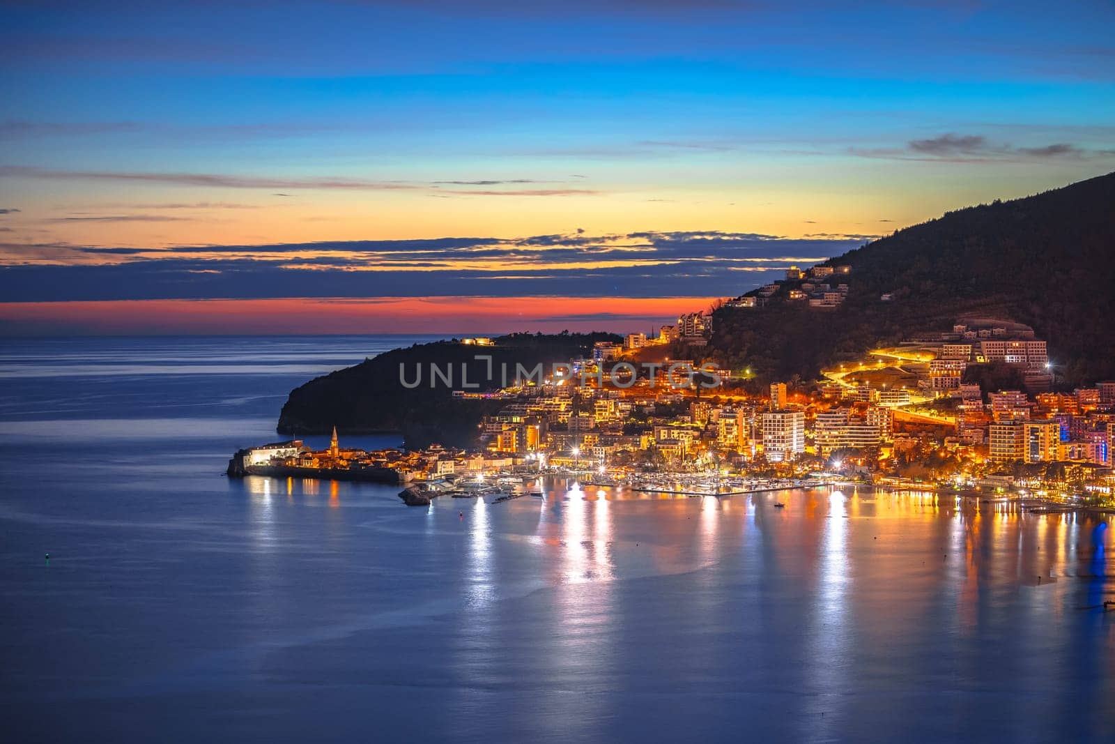 Town of Budva coastline architecture colorful evening view by xbrchx