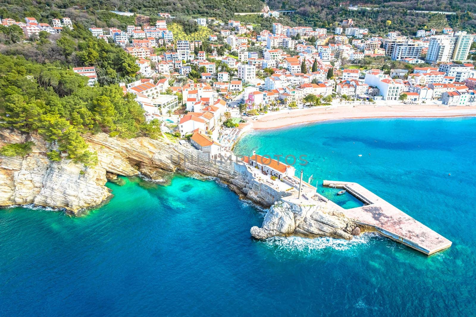 Town of Petrovac beach and coastline aerial view, archipelago of Montenegro