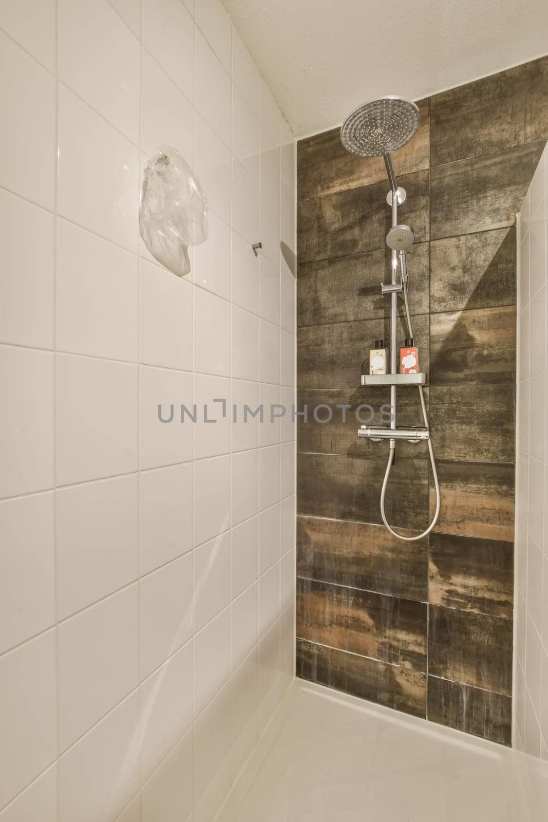 a bathroom with a shower and a wooden wall by casamedia