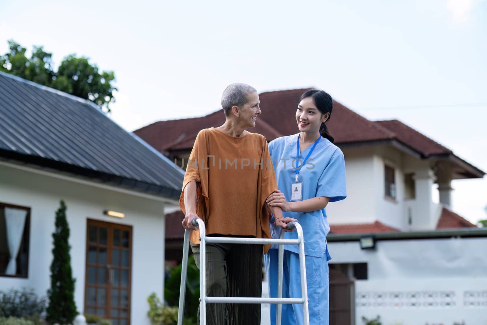 Nurse or caregiver hand on walking frame for support, help or trust moving leg in rehabilitation. Physiotherapy healthcare, Medical caregiver consulting disabled elderly patient at home.