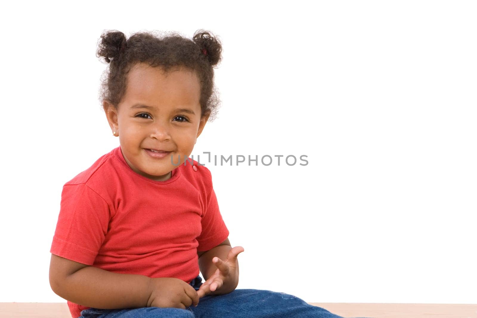 Adorable african baby sitting