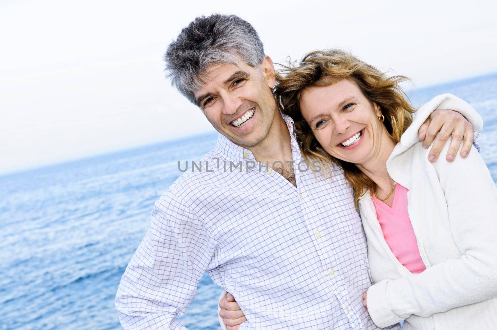 Mature romantic couple at seashore