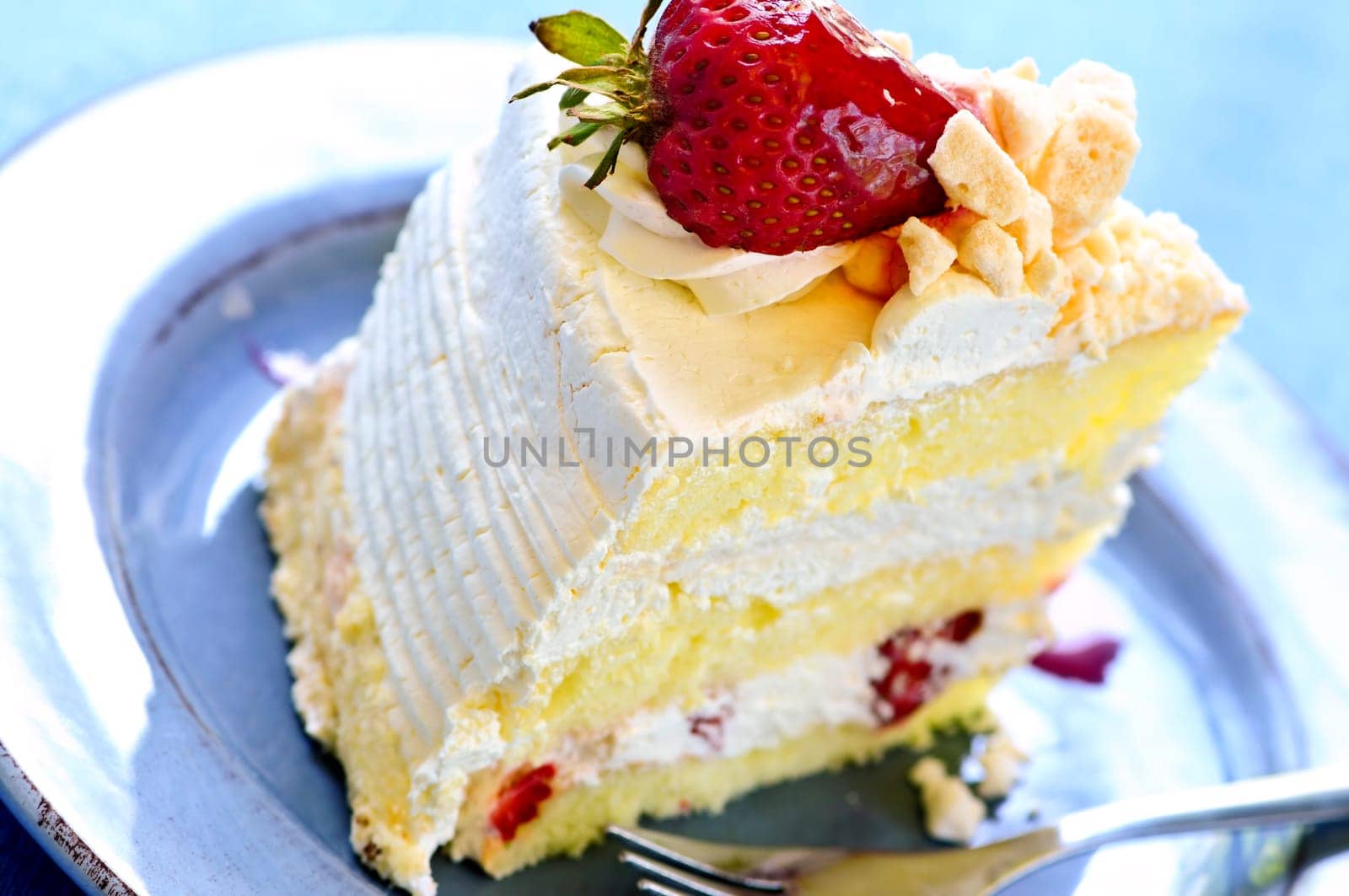 Slice of strawberry meringue cake