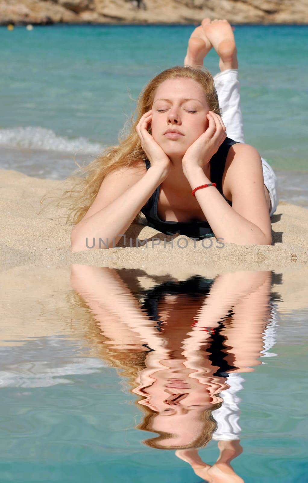 Woman relaxed by the sea