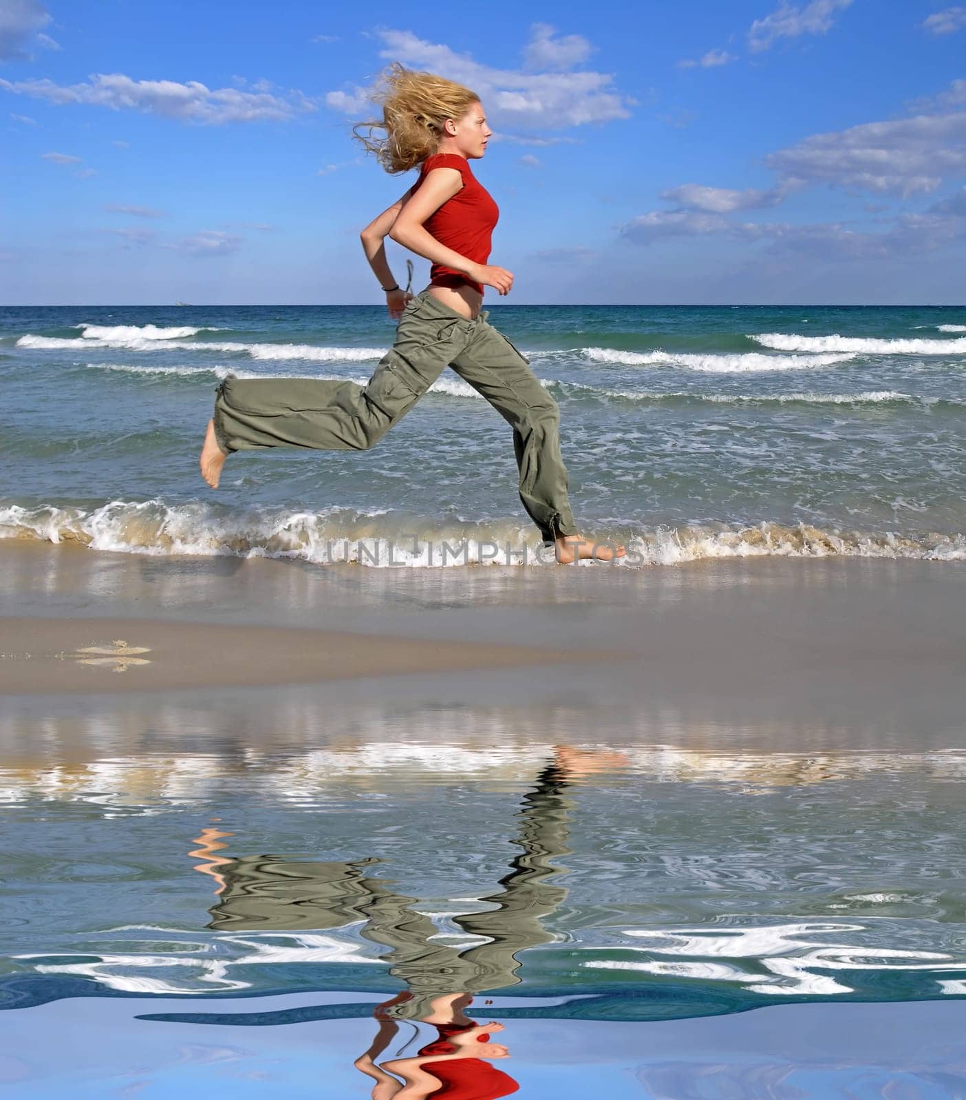 Woman running by the sea