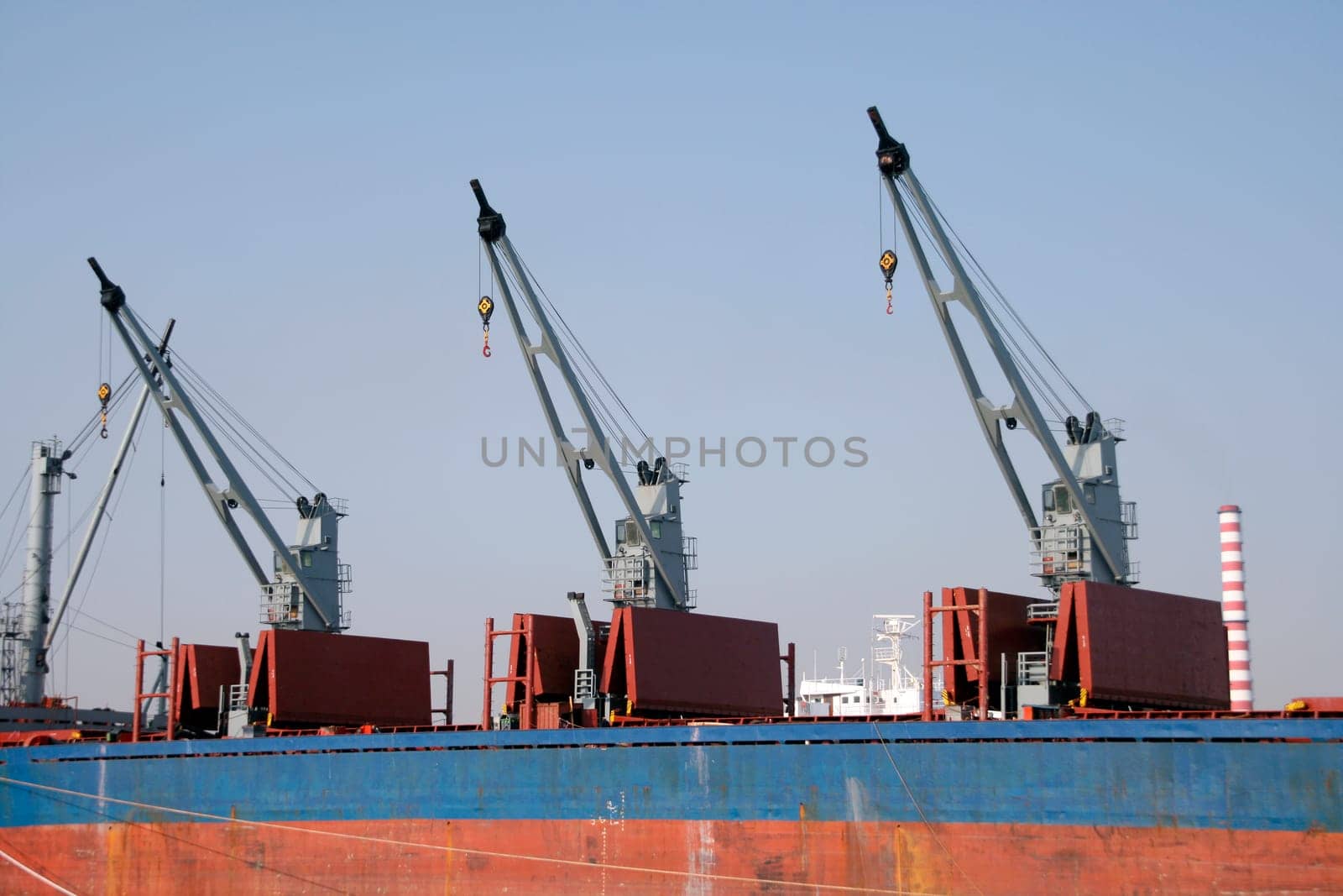 three cargo cranes