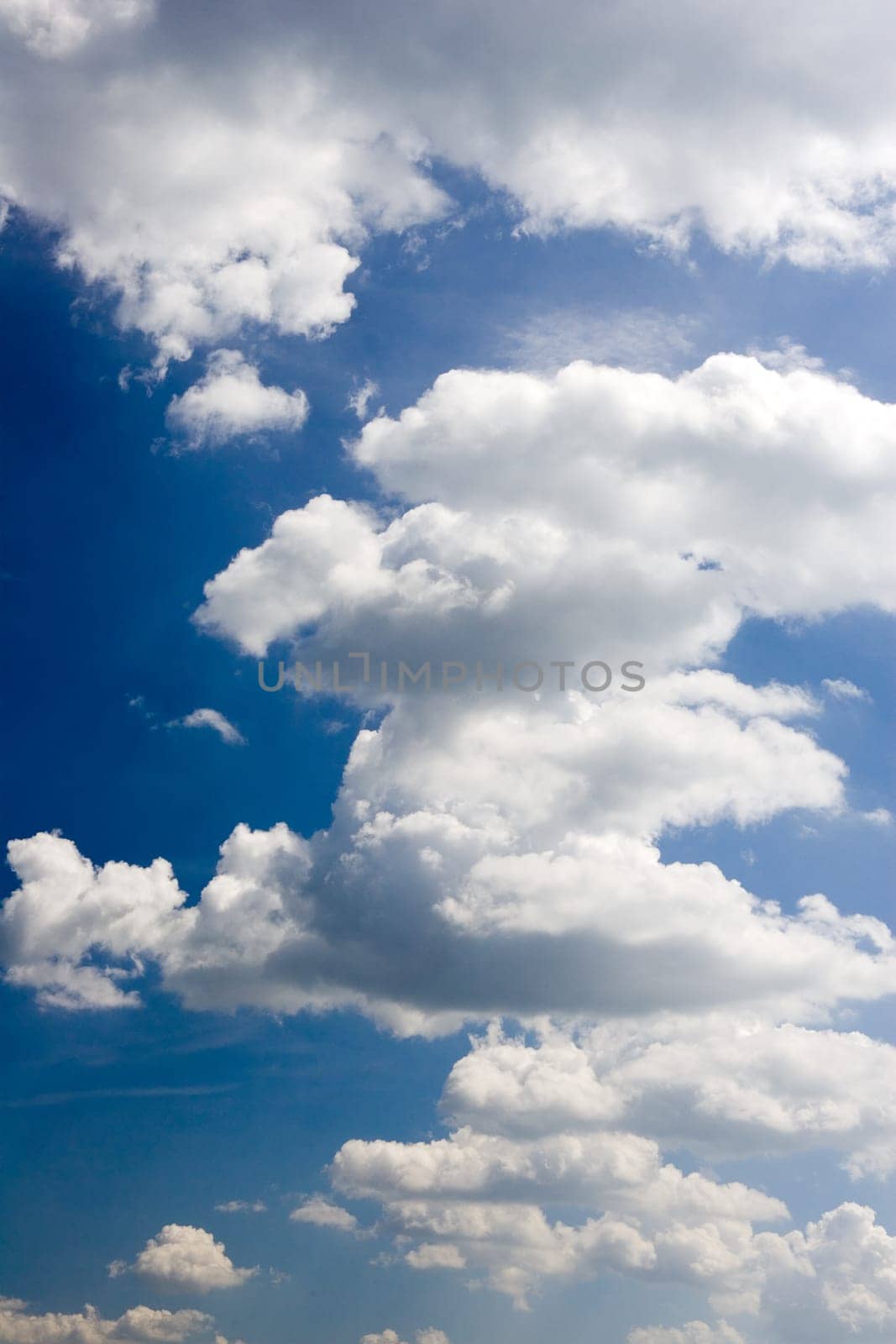 Blue sky with clouds upright