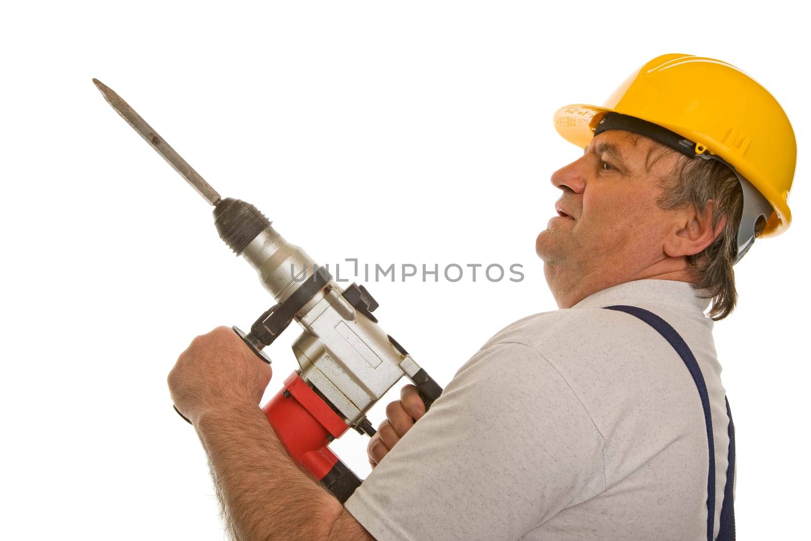 Worker with hammer drill and hard hat