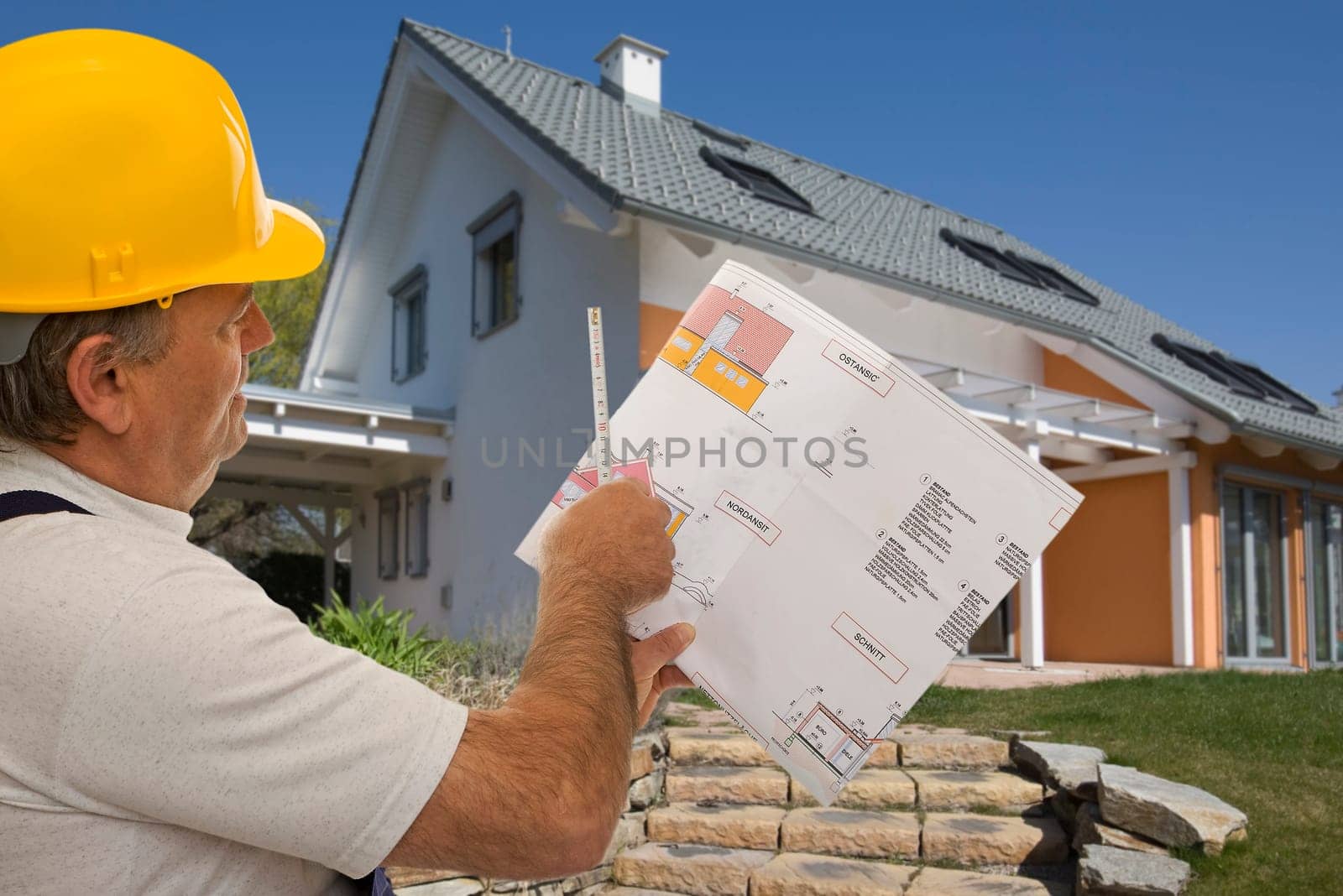 Construction worker with an architect's plan