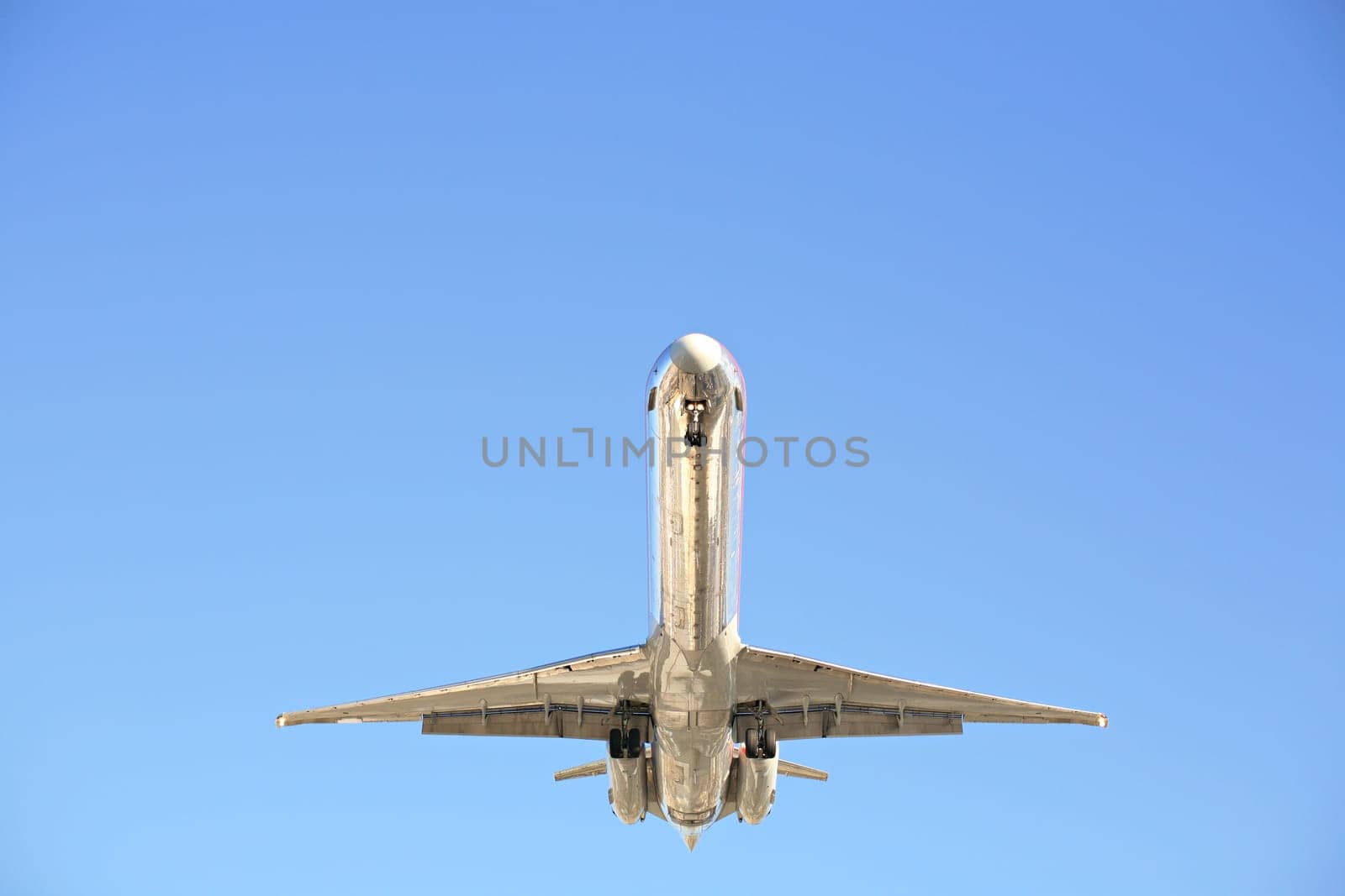 airplane against clear blue sky