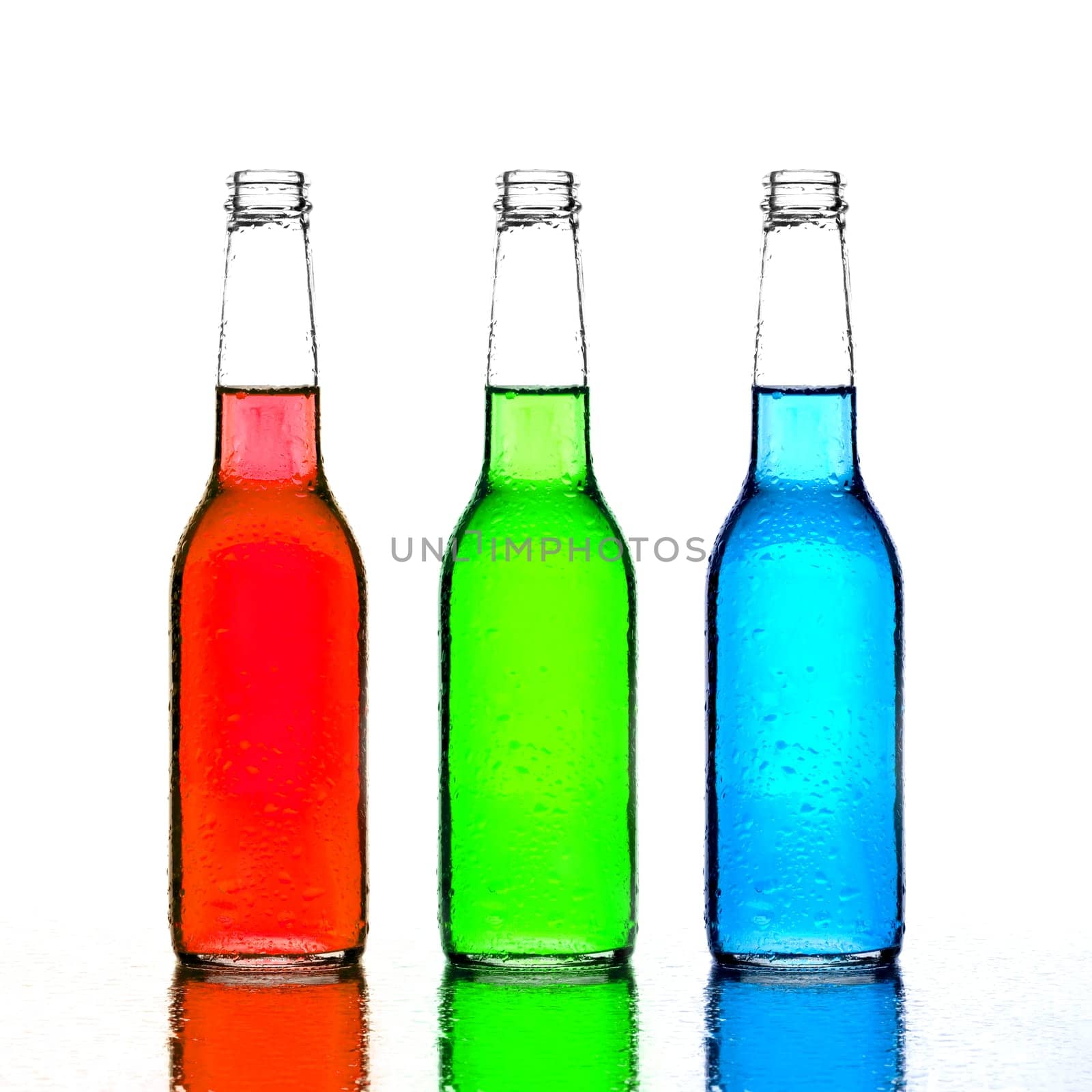 bottles red green and blue with reflection isolated on white