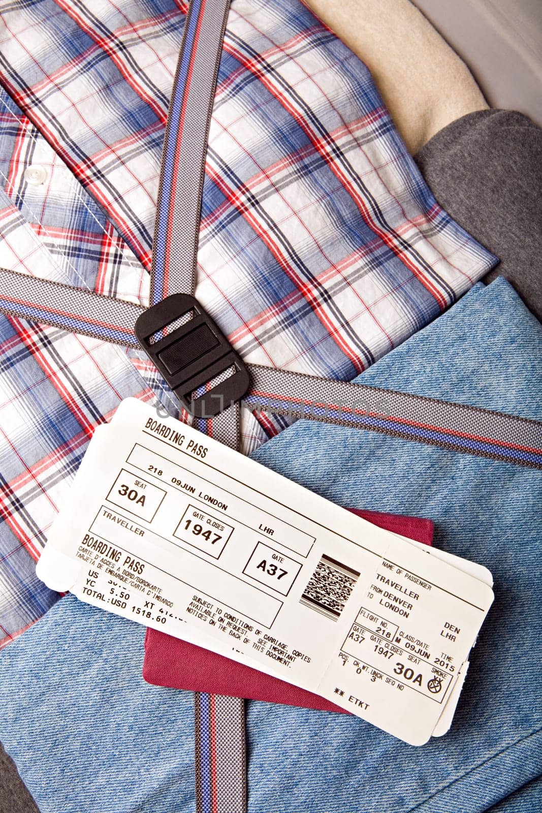 boarding pass passport on suitcase
